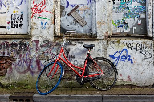 Red bike against a grafitti wall