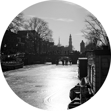 Bevroren Prinsengracht in de ochtendzon Amsterdam van Stewart Leiwakabessy