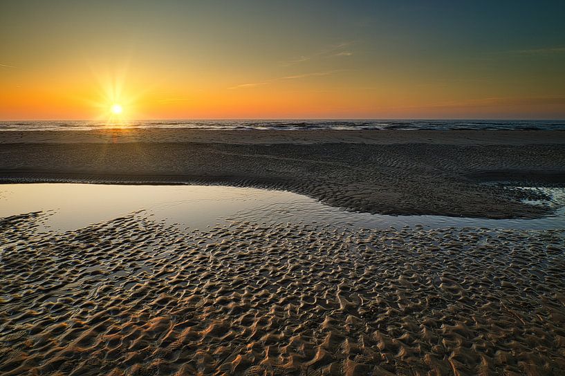 Structures in the beach at sunset by peterheinspictures