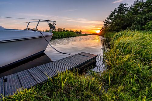 Setting sun at docked boat
