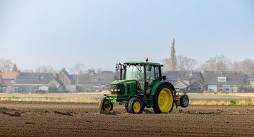 Agriculture in Action: John Deere Tractor in the Field by Triki Photography