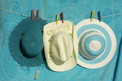 Three hats on a line