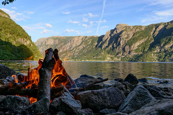 Campfire in a fjord in Norway during summer