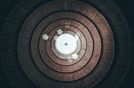 Airplane above a cooling tower by Martijn Van Weeghel thumbnail