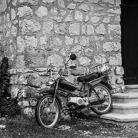 Old motorbike in front of house wall by Fartifos