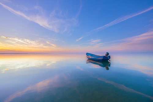 Lonely boat in a sea of pastel shades