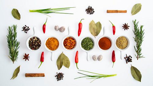Herbs and spices in white jars