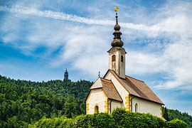 A view of the churches of Maria Woerth on Lake Woerthersee in Au by Andreas Völkel