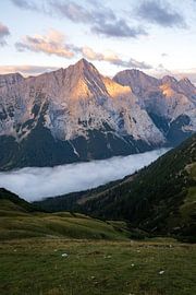 Mountain Hohe Wand at sunrise with fog in valley by Daniel Pahmeier