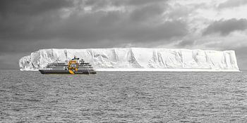 Boat in front of an iceberg