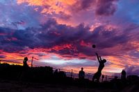 sunset with playing youth