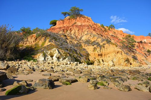 Colourful rocks on beach Portuguese Algarve