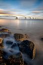 Zeelandbrug met rotsen in het ochtendlicht van Mark Bolijn thumbnail