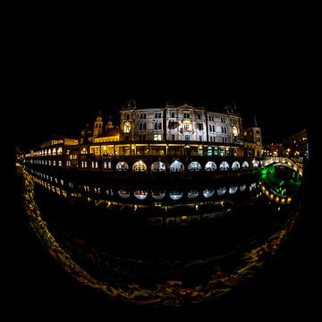 Night photograph with reflection of market place in Ljubljana, Slovenia by Herman van Heuvelen