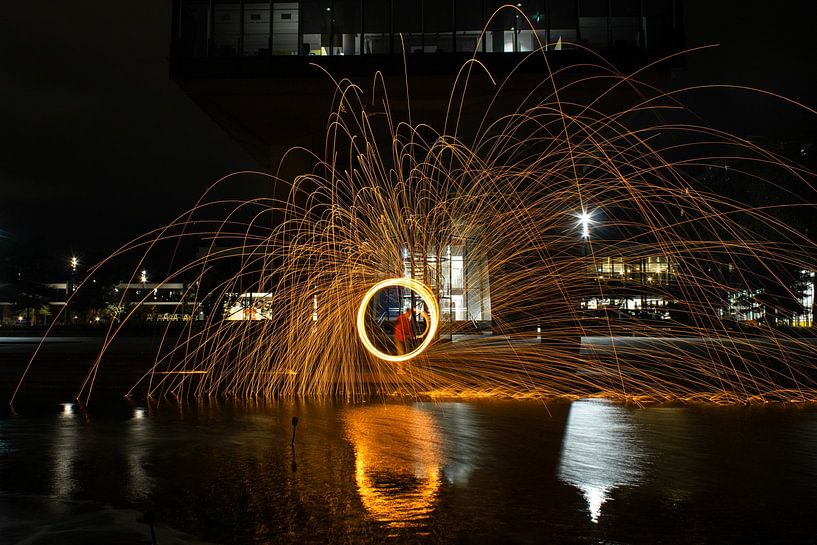 Lightpainting with steel wool reflected in the water by Daphne Dorrestijn