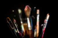 Paintbrushes on a black background