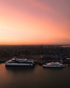 Sunset over the harbour of Harlingen by Ewold Kooistra