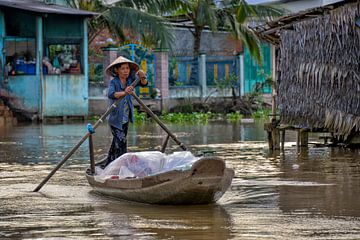 Vietnamese merchant on the floating market by Richard van der Woude