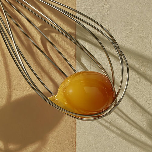 Whisk with egg yolk