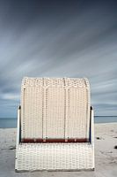 Beach chair under upcoming thunderstorm