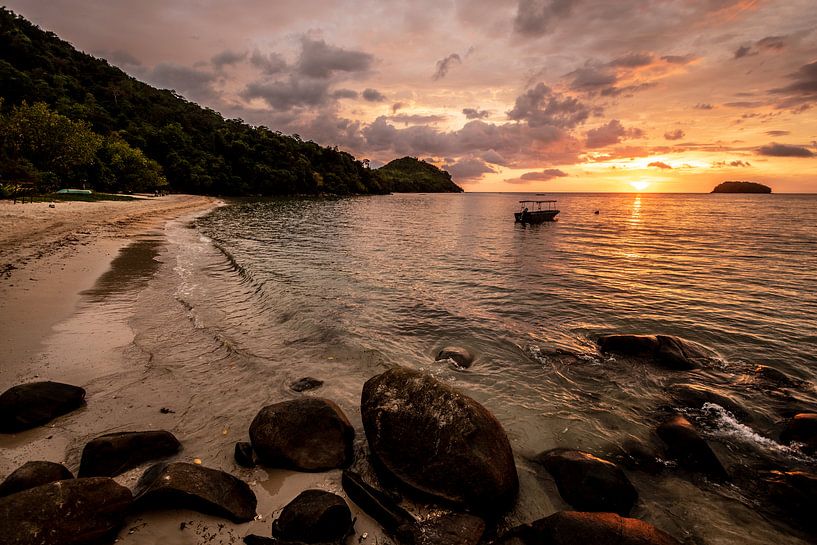 Sunset on the beach with a boat by Femke Ketelaar