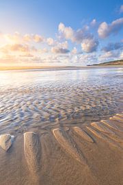 The beach at Hargen aan Zee at low tide with a beautiful sunset. The bright light gives the colours  by Bas Meelker