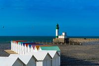Beach huts and lighthouse in Le Treport, France