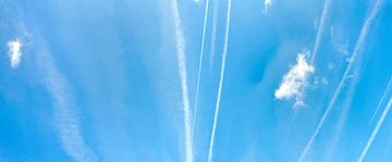 Cloud-like streaks across a blue sky by Lilly Wonderz