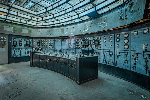 Abandoned industrial control room with glass roof