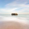 Bunker in the sea at sunset by Claire van Dun