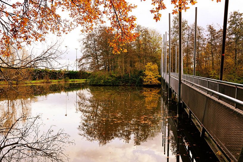 Bridge over water with focus on water by Dennis van der Geest