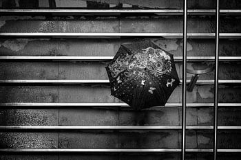 Cheerful umbrella on the steps of the Entre Deux shopping centre