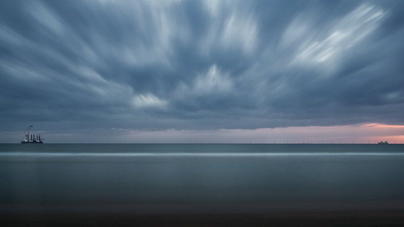 Sea view at sunset with threatening clouds. by Robert Lodewijks