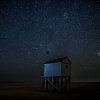 Little shipwreck shelter under a starry sky at the isle of Terschelling by Maurice Haak