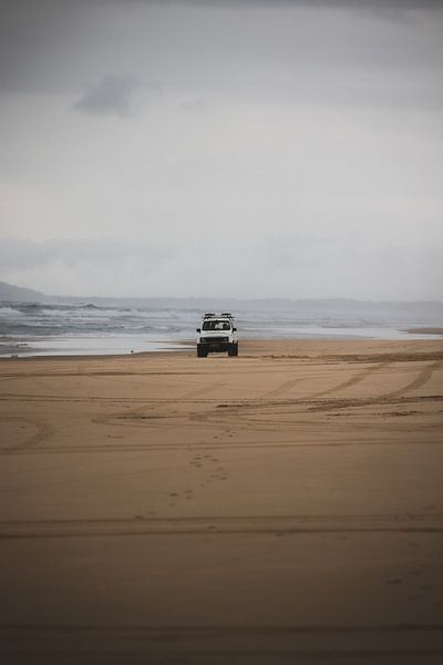 Jeep on the beach in Hat Head National Park Australia by Ken Tempelers