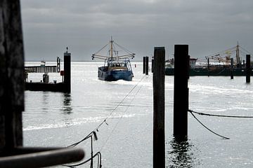 Fishing boat sets sail by Fred Hermans