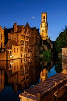 The Rozenhoedkaai with moon just after sunset, Bruges, Belgium.