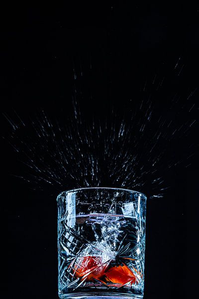 2 Subtle tomatoes in a glass of water by Ruud Hilhorst