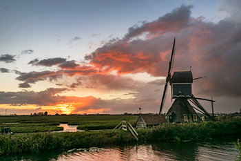dutch windmill at sunset