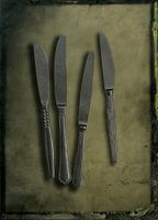 Still life of knives on tin background