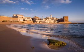 Golden Sands and Tranquil Waters at Punta Secca in Ragusa, Sicil by PhotoCluster