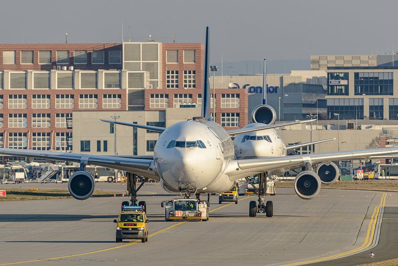 Lufthansa Airbus A340 and Lufthansa MD-11. by Jaap van den Berg
