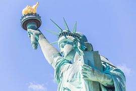 Close view of the Statue of Liberty over blue sky by Maria Kray