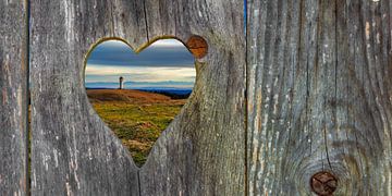 View through a heart into the landscape by Jürgen Wiesler