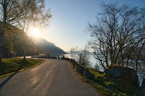 Car park overlooking the road, Nordfjord and Bergen in Norway. Sun rays