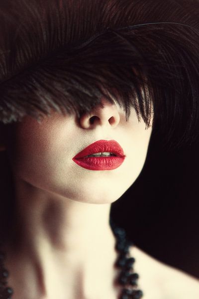 Lips and feather by Magdalena Russocka