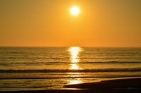 Zonsondergang aan zee