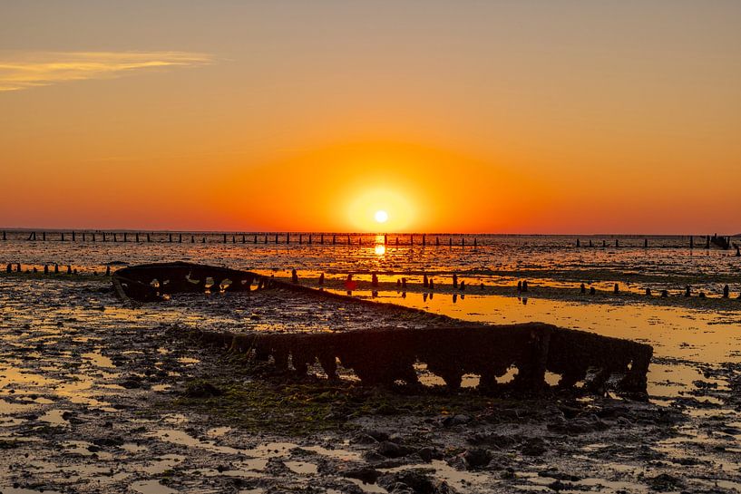Wadden Sea, sunrise at Paesens Moddergat (Shipwreck of Wierum) by Gert Hilbink