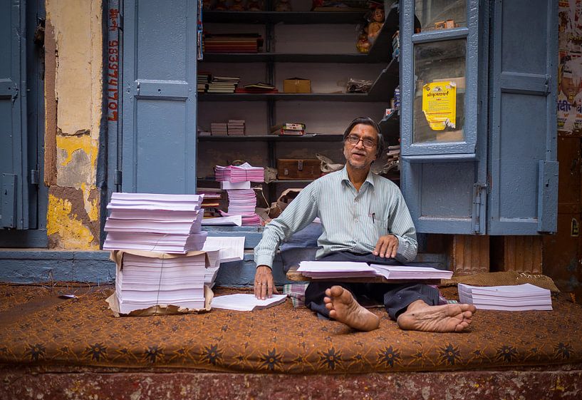 Man in front of his copy shop in Varanasi, India by Teun Janssen