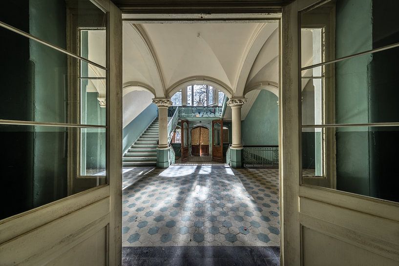 Doors to large hall with stairs by Inge van den Brande